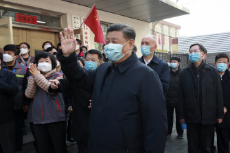 Xi Jinping greets people in a Beijing neighbourhood amid the coronavirus outbreak.