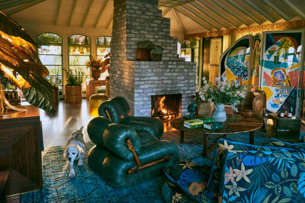 The living room at Flamingo Estate, featuring a David Hockney four-panel 
screen to the right. 