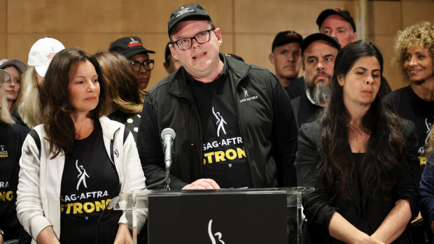 Duncan Crabtree-Ireland, SAG-AFTRA National Executive Director and Chief Negotiator, speaks next to SAG-AFTRA union President Fran Drescher at SAG-AFTRA offices.