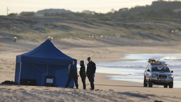 Police set up a crime scene after a woman's body was found on North Cronulla Beach.