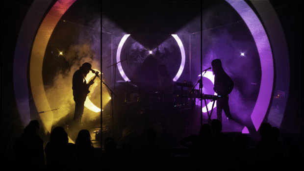 Trippy lighting design accompanies Moon Duo on stage. 