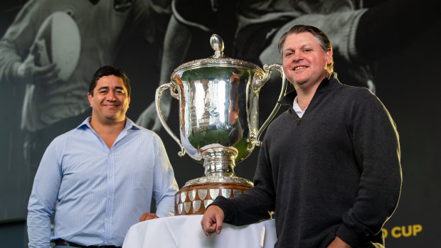 Former Wallabies centre Morgan Turinui  (left)and prop Matt Dunning (right) pose with the Bledisloe Cup in Sydney on Wednesday. 