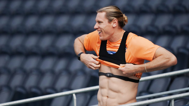 Mark Blicavs puts on a heart-rate monitor at training this week.