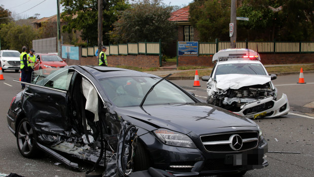 A police car and Gay Vieira's Mercedes-Benz after the serious collision in Cronulla.
