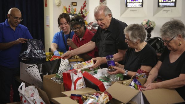 Reverend Bill Crews  and volunteers of the Exodus Foundation with  Christmas donations in 2020. They are appealing again for donations this year.