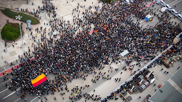 Police cars stand across the road as police separate leftist and nationalist demonstrators in Chemnitz, eastern Germany, on Saturday.