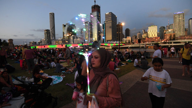 Crowds gather to watch New Year's Eve fireworks at South Bank in Brisbane.
