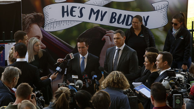 Tone deaf: NSW Racing Minister Paul Toole and Greyhound Racing NSW CEO Tony Mestrov are backed by a "He's My Buddy" sign, with no sense of irony.