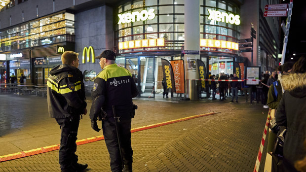 Dutch police secure a shopping street after a stabbing incident in The Hague on Friday.