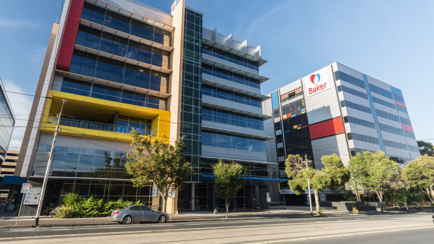 The Burnet Institute (left) and the Baker Institute (right) in South Yarra are both covered in combustible cladding.