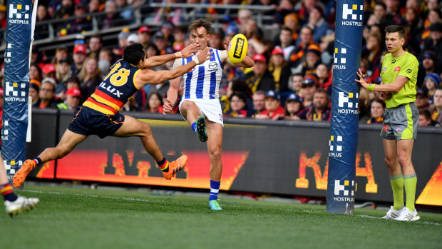 Off the boot: Eddie Betts smothers a kick by North's Ryan Clarke.