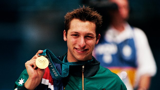 Australia’s Ian Thorpe shows off his gold medal following the men’s 400-metre freestyle swimming event at the Sydney 2000 Olympic Games.