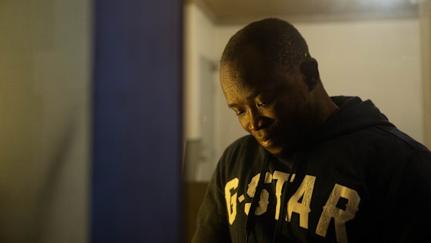 Weightlifting champion Musa Kamara came to Australia from Sierra Leone to compete in the 2006 Commonwealth Games. He was one of 14 athletes who ran away from the village and sought political asylum. He now lives in Liverpool and drives an Uber while studying. 