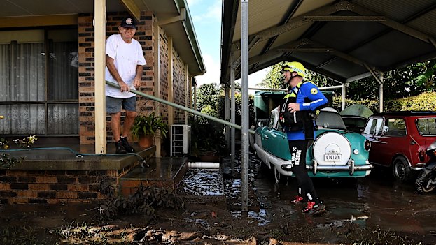 Kile Nicholas checks on Phil Lorking, 80, in the isolated village of Croki last week.