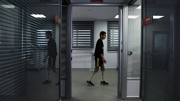 'I am ashamed': Abdalrahman tries out his new legs.