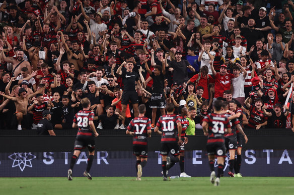 The Red and Black Bloc revel in Amor Layouni’s second goal.
