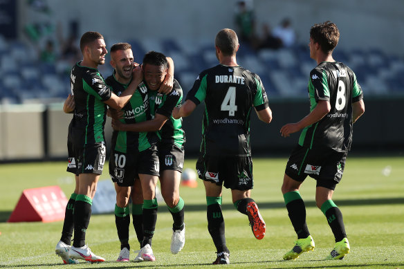 Steven Lustica celebrates with Western United teammates after scoring the decisive goal against Perth Glory on Saturday.
