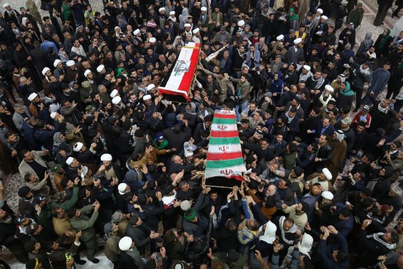 Mourners in Baghdad carry the coffins of Iran's General Qassem Soleimani and Mahdi al-Muhandis, the Iraqi deputy commander of Iran-backed militia.