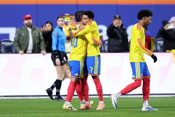 James Rodriguez of Colombia celebrates with teammate Luis Diaz.