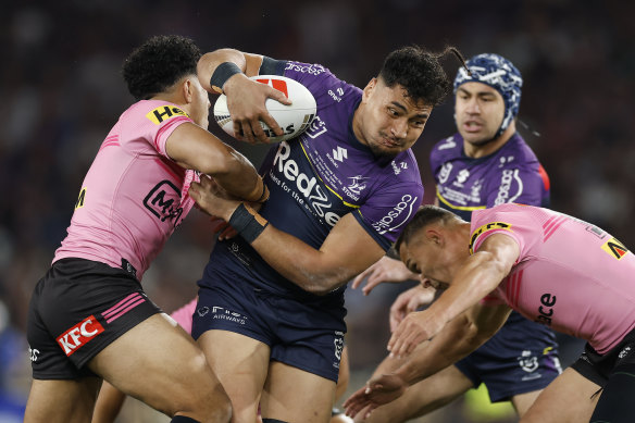 Eliesa Katoa of the Storm is tackled during the 2024 NRL Grand Final match between the Melbourne Storm and the Penrith Panthers. 