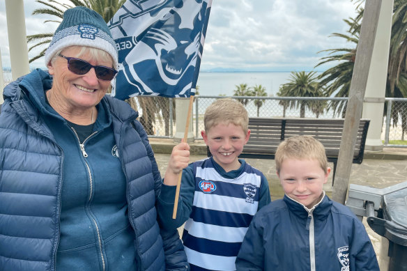 Pam Morrow with grandsons Harry, 8, and Tommy, 7, during Geelong’s premiership parade. 