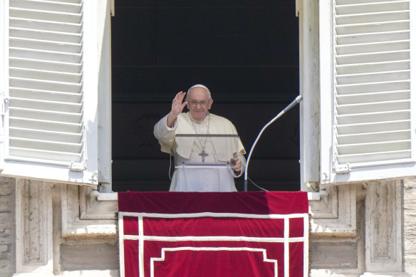 Pope Francis recites the Angelus noon prayer from the window of his studio overlooking St Peter’s Square, at the Vatican, on Sunday.