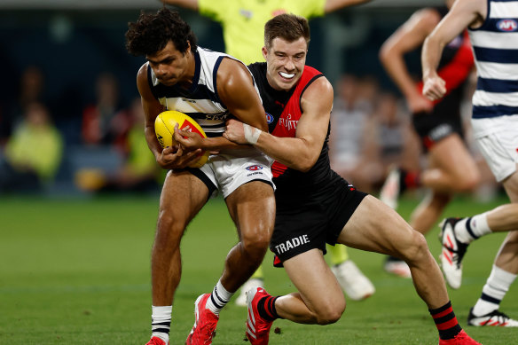 Bombers captain lays a tackle on Lawson Humphries.