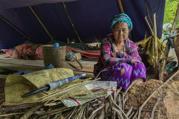 A woman in a makeshift tent in a displaced-person’s camp in Kayah, eastern Myanmar. An estimated 108,800 people in the region have fled their homes following fighting between the military and the local militia. 