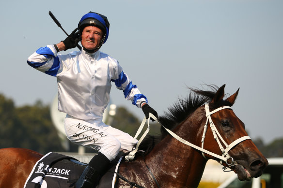 Glen Boss interacts with the crowd after winning the Golden Eagle aboard Kolding in 2019.