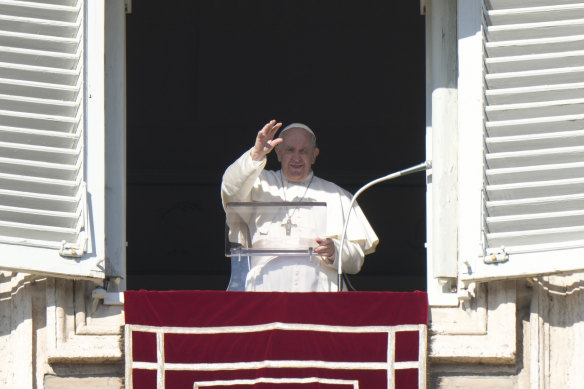 Pope Francis delivers a blessing from the window of his studio overlooking St Peter’s Square, at the Vatican, on New Year’s Day.