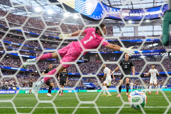 NZ goalkeeper Max Crocombe is beaten by Mohammad Mohebi’s finish.