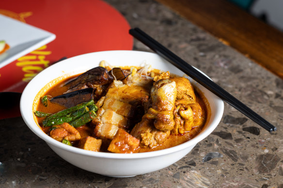 Malaysian curry mee with crispy pork.