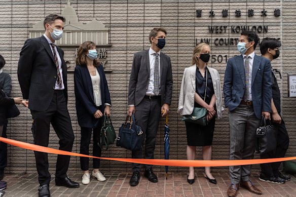 Consular representatives from Australia, from second right, Canada, Sweden, France and the Netherlands stand in line outside the West Kowloon Magistrates Courts ahead of Friday’s hearing.