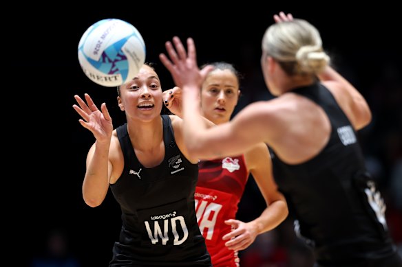 Mila Reuelu-Buchanan of Team New Zealand offloads the ball during the Semi-Final match between Team New Zealand and Team England.