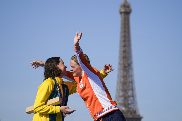Gold medallist Sharon Van Rouwendaal, of the Netherlands, right, hugs silver medallist Australia’s Moesha Johnson, left, during the medal ceremony