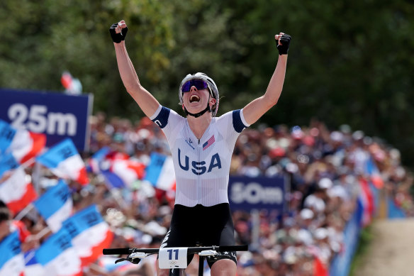 Haley Batten celebrates as she crosses the finish line to win silver in the women’s cross-country cycling mountain bike Gold Medal race on day two of the Paris Games.