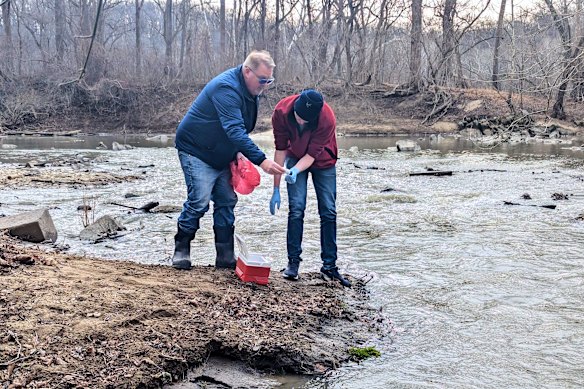 Water samples are taken from the Potomac River in Glen Echo, Maryland, last week.