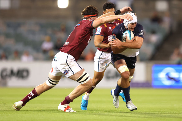 Rory Scott carries the ball agianst the Reds.