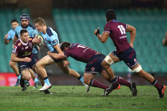 James O’Connor readies himself to make a tackle on Joey Walton.