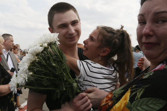Relatives greet freed Ukrainian prisoners freed as they step off a plane in Kiev.