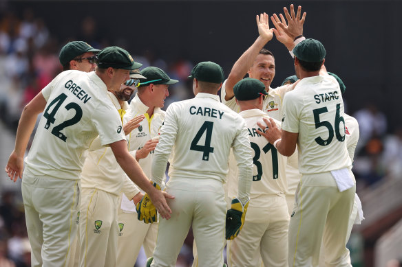 Scott Boland and Australia celebrate.