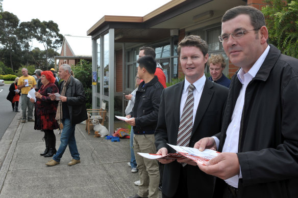 Ben Carroll during the 2012 Niddrie byelection alongside then opposition leader Daniel Andrews.