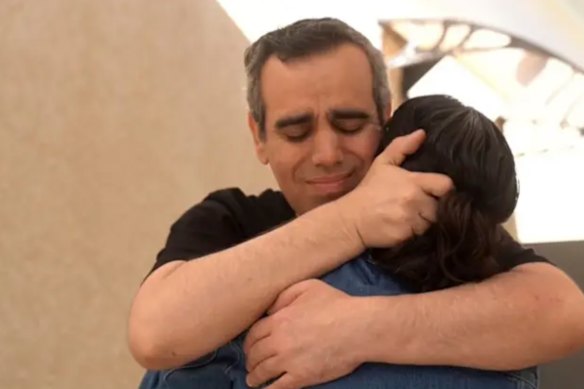 Omri Miran, 48, reunites with wife Lishay at the initial reception point in southern Israel.