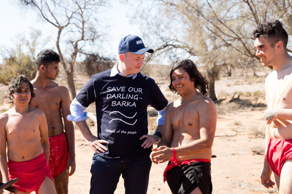 NSW Environment Minister, Matt Kean, meets with dancers in the newly expanded Mutawintji national park.