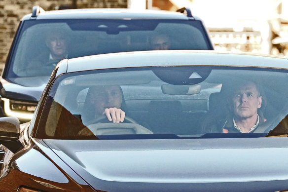 Britain’s Prince William, left, drives away from the London Clinic on January 18.
