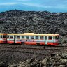 The Ferrovia Circumetnea riding its rocky landscape.