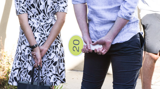Domain Saturday Auction Sydney. Generic  Live onsite auction  Covid 19 Coronavirus . Story by Tawar Razaghi - Auction by  Ray White Surry Hills / Alexandria of a brand new 3 bedroom  terrace at 33a Pearl Street Newtown.  Photo shows, Bidders at the auction with their auction paddle . Photo by Peter Rae. Saturday 9 May, 2020.