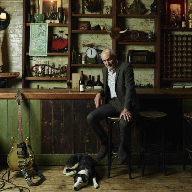 Paul Kelly (with dog Queenie) at Bakehouse Studios, the rehearsal space he uses in Melbourne’s Richmond. “You can’t see the next song coming. They catch you by surprise, or by accident … you have to keep 
your ears open,” he says of his 40-year songwriting career.