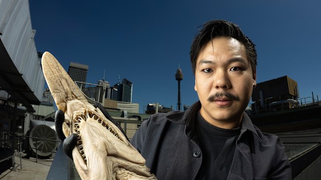 Dr Yi-Kai Tea, popularly known as Kai the Fish Guy, holds a baby version of a goblin shark.