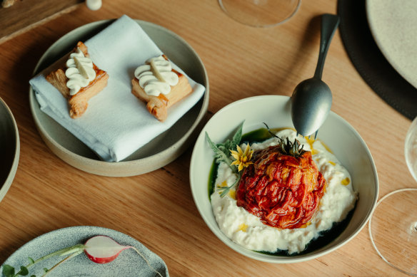 Dishes such as dried tomato with smoked stracciatella (right) are designed around the garden and a large wall of preserves.